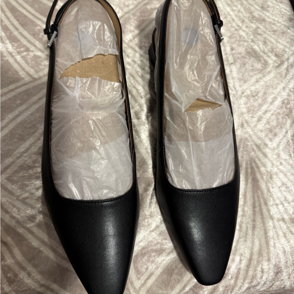 Black sling back one inch block heel. New size 10.